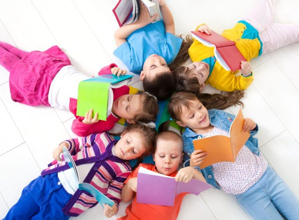Image of a group of children enjoying reading together.