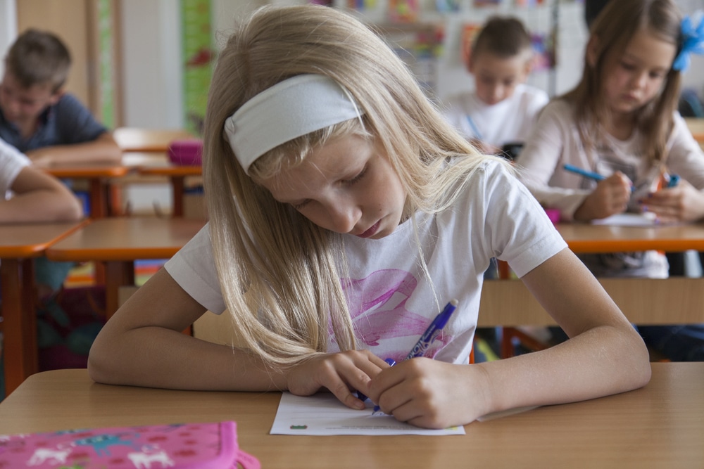 Image of first grade student writing